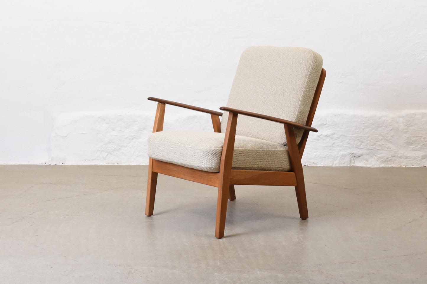 Newly reupholstered: 1950s teak + oak lounge chair