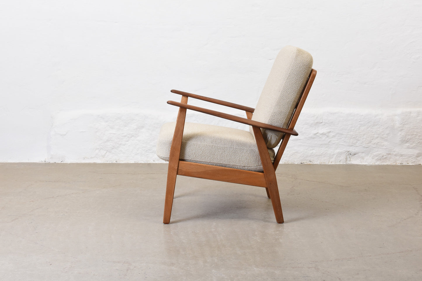 Newly reupholstered: 1950s teak + oak lounge chair