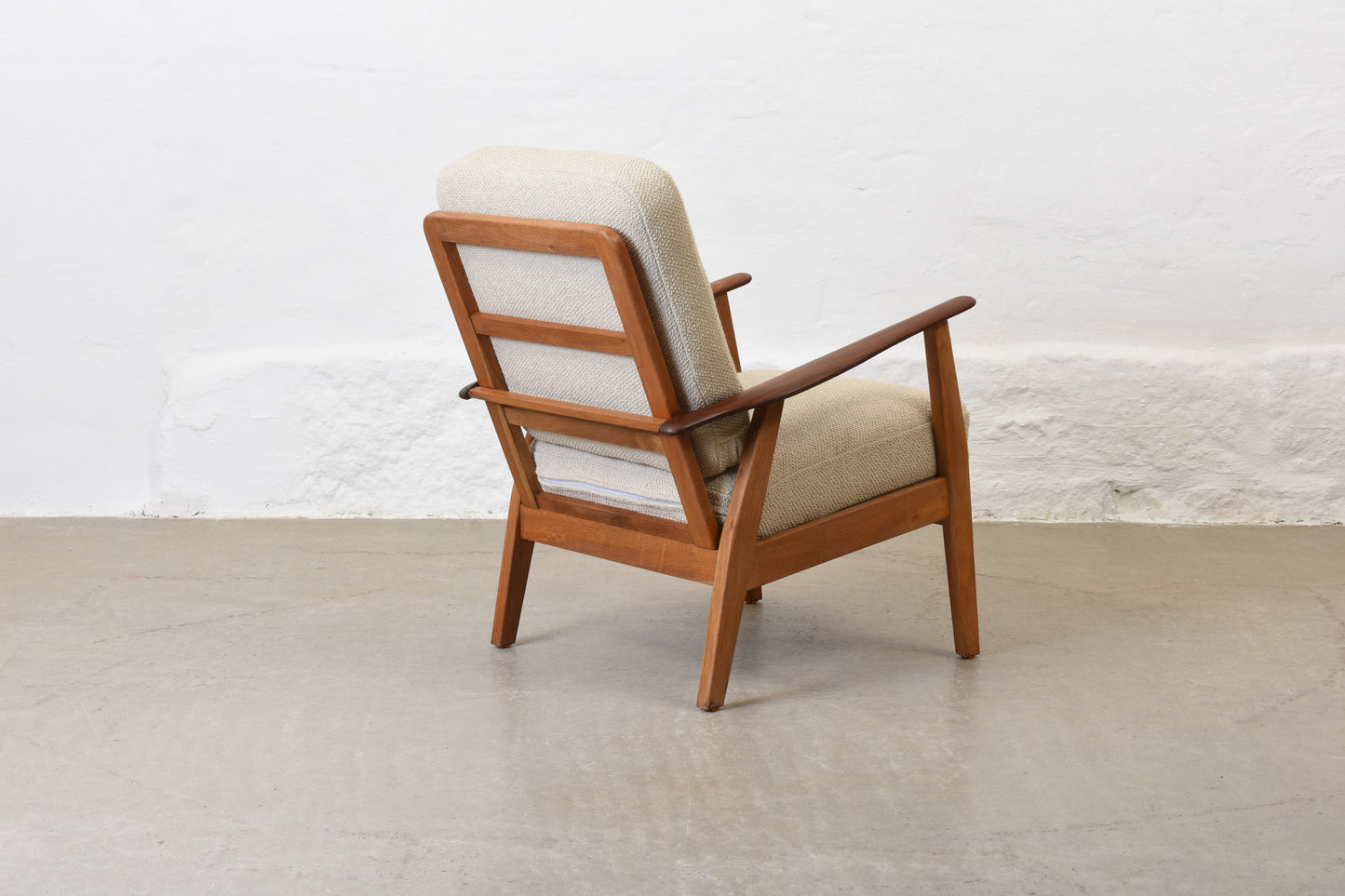 Newly reupholstered: 1950s teak + oak lounge chair