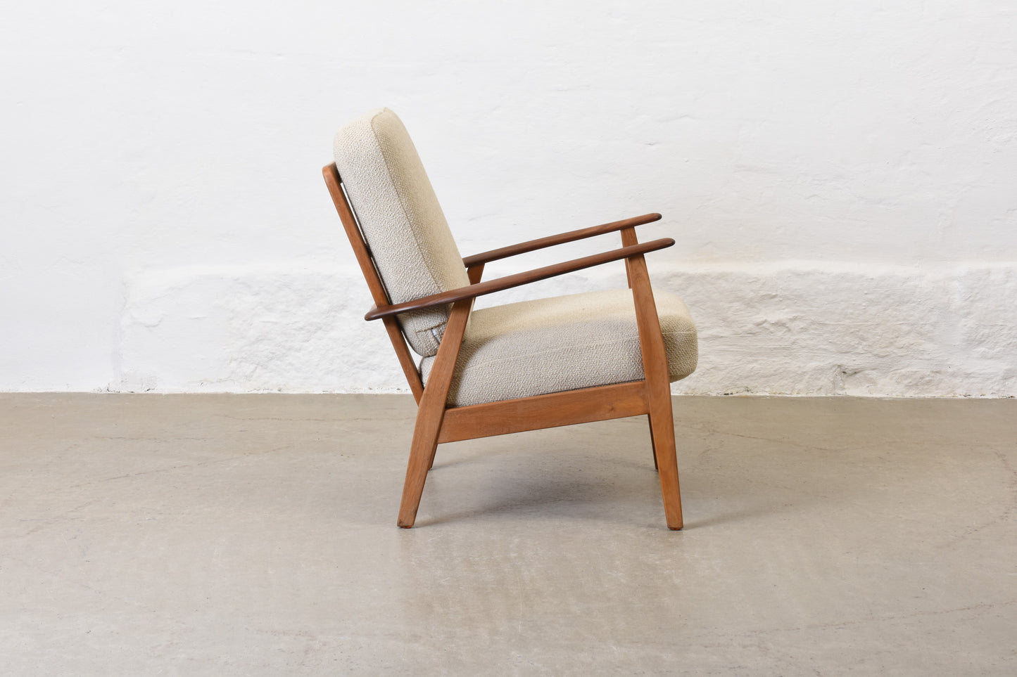 Newly reupholstered: 1950s teak + oak lounge chair