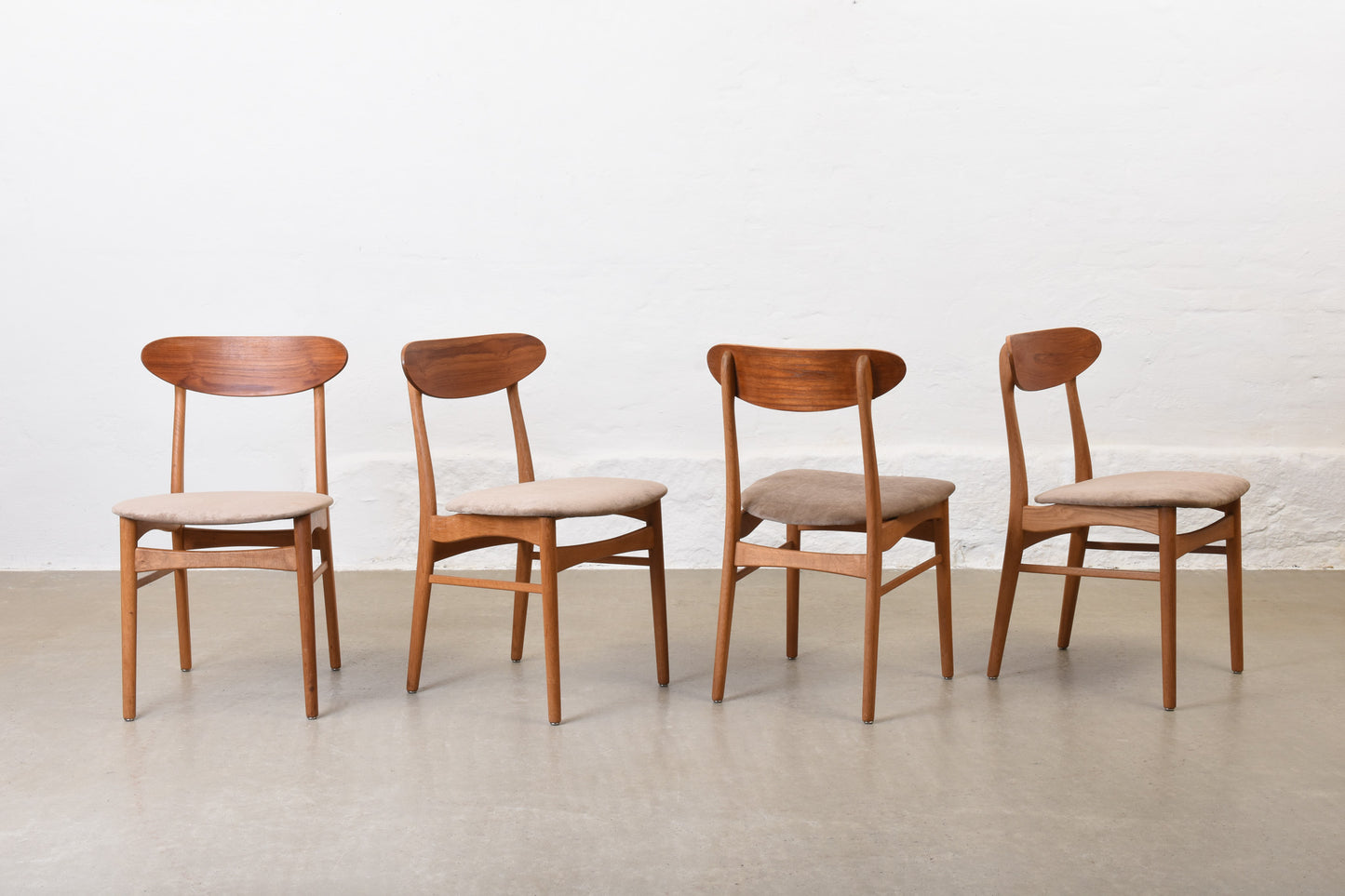 Newly reupholstered: 1960s set of four teak + oak dining chairs