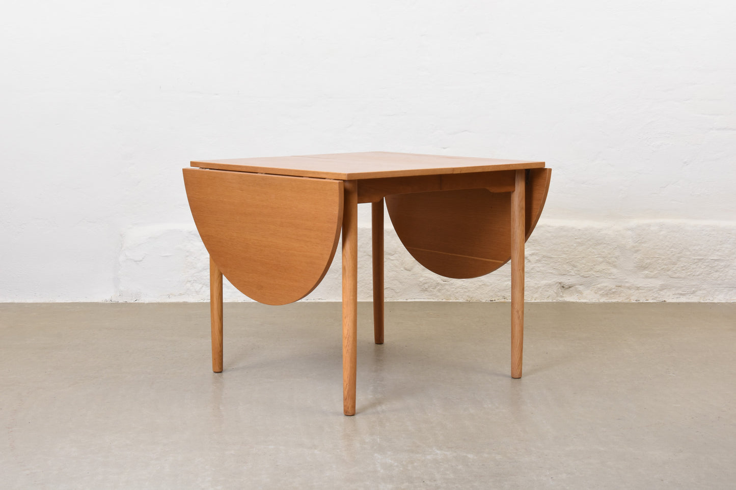 1960s extending drop-leaf dining table in oak