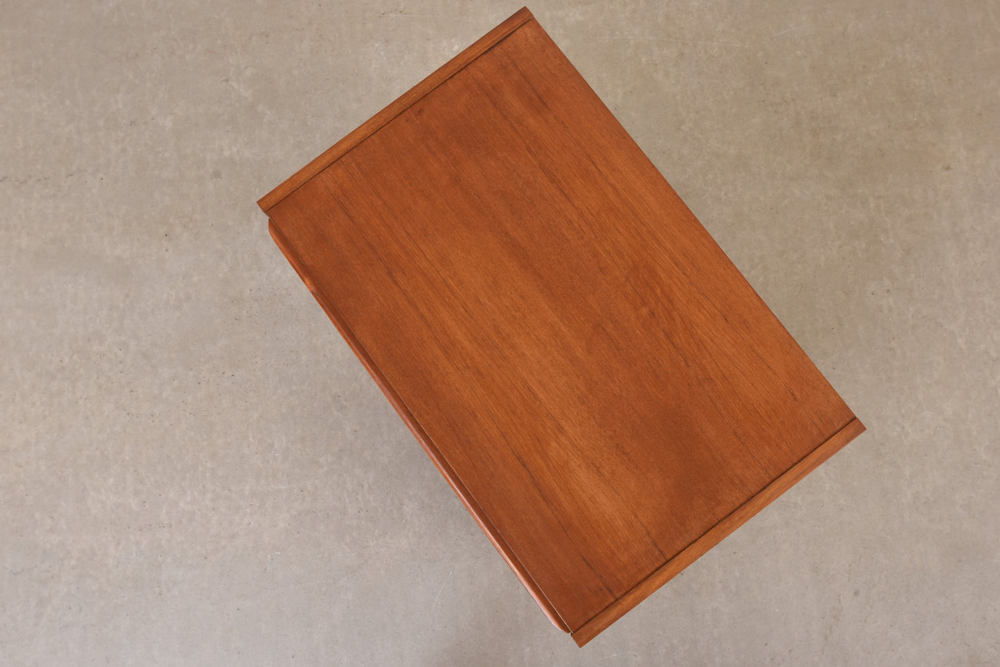 Narrow teak chest of drawers with lipped handles - 104H cm
