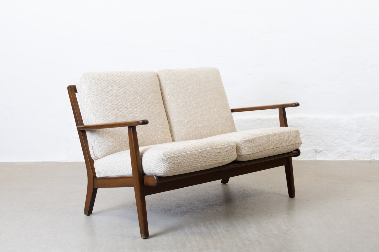 Newly reupholstered: 1950s two seater by Aage Pedersen