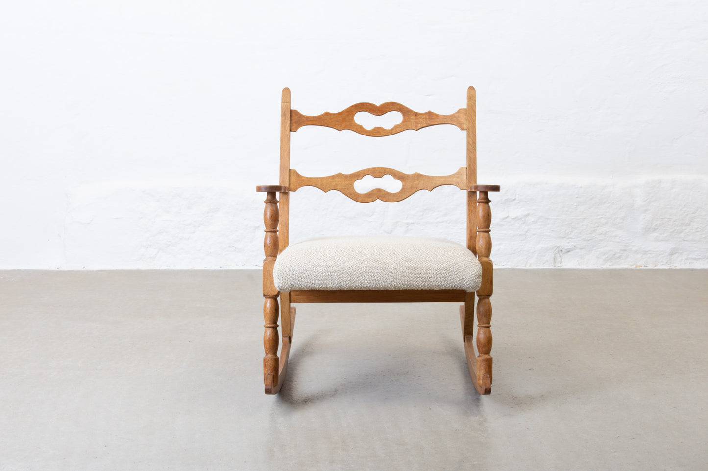 Newly reupholstered: 1960s oak rocking chair by Henning Kjærnulf