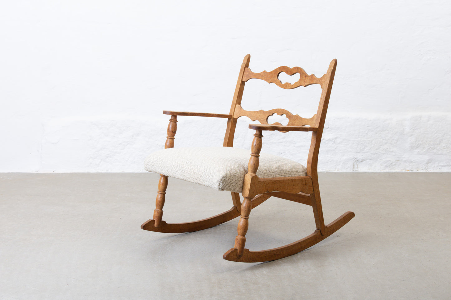 Newly reupholstered: 1960s oak rocking chair by Henning Kjærnulf