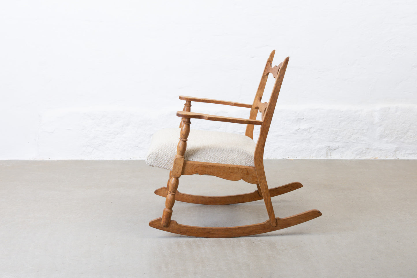 Newly reupholstered: 1960s oak rocking chair by Henning Kjærnulf