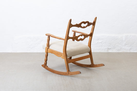 Newly reupholstered: 1960s oak rocking chair by Henning Kjærnulf