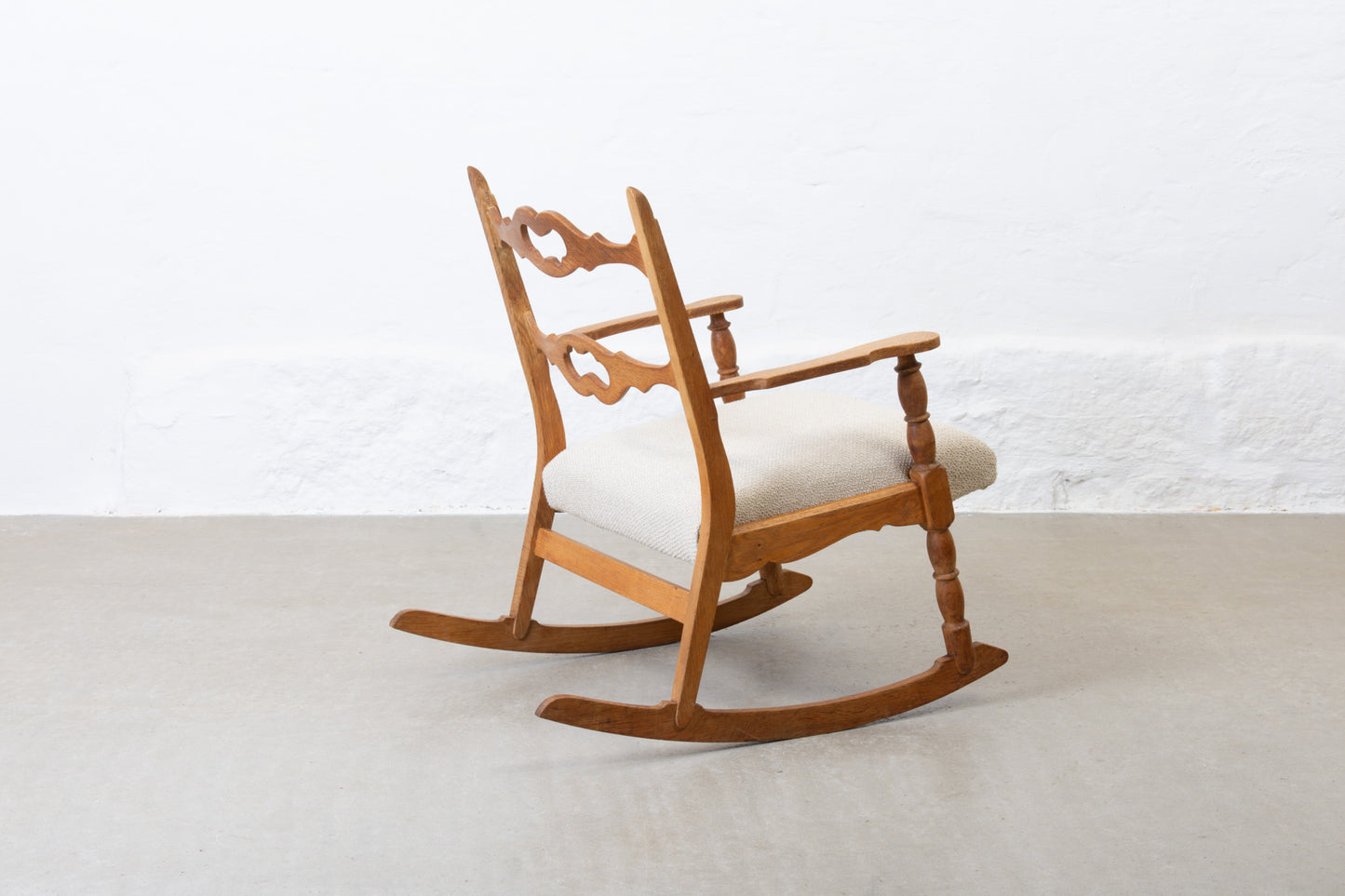 Newly reupholstered: 1960s oak rocking chair by Henning Kjærnulf
