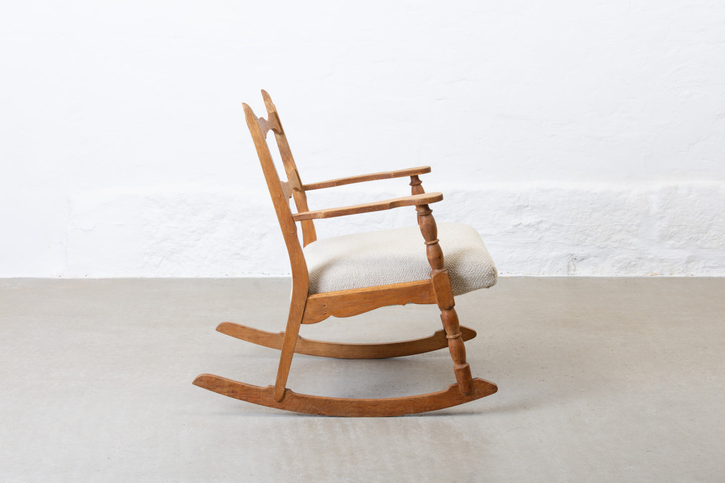 Newly reupholstered: 1960s oak rocking chair by Henning Kjærnulf
