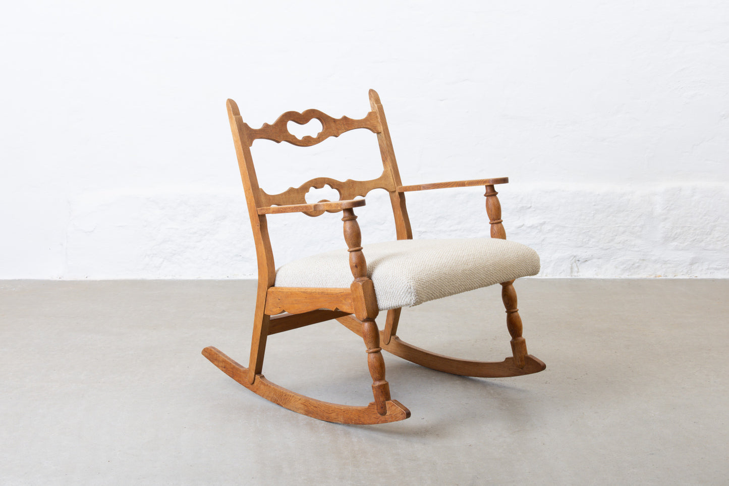 Newly reupholstered: 1960s oak rocking chair by Henning Kjærnulf