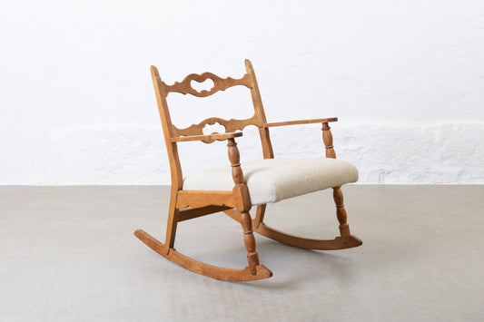 Newly reupholstered: 1960s oak rocking chair by Henning Kjærnulf