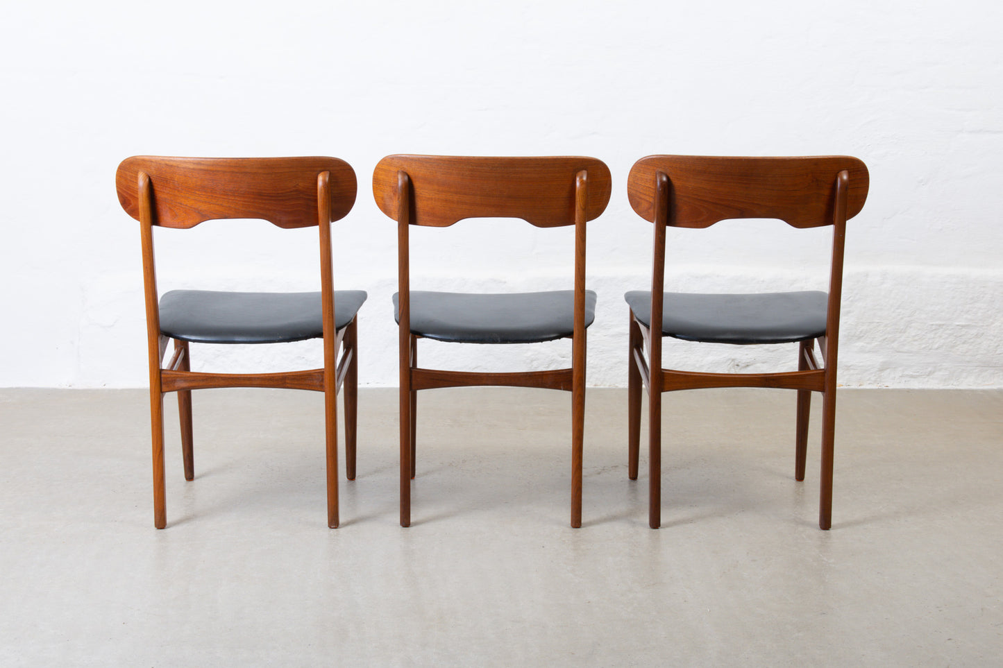 Three available: 1960s teak + vinyl chairs