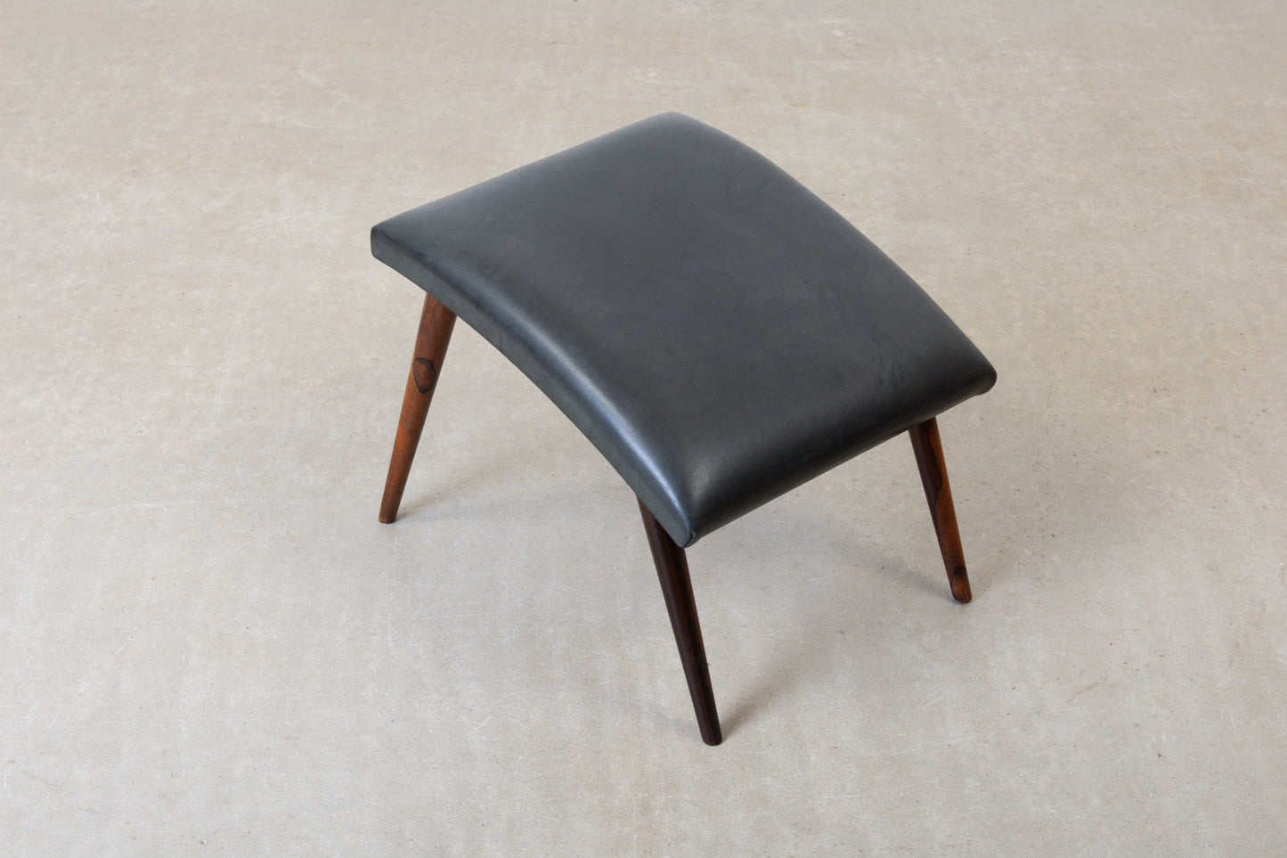 1960s leather foot stool on rosewood legs