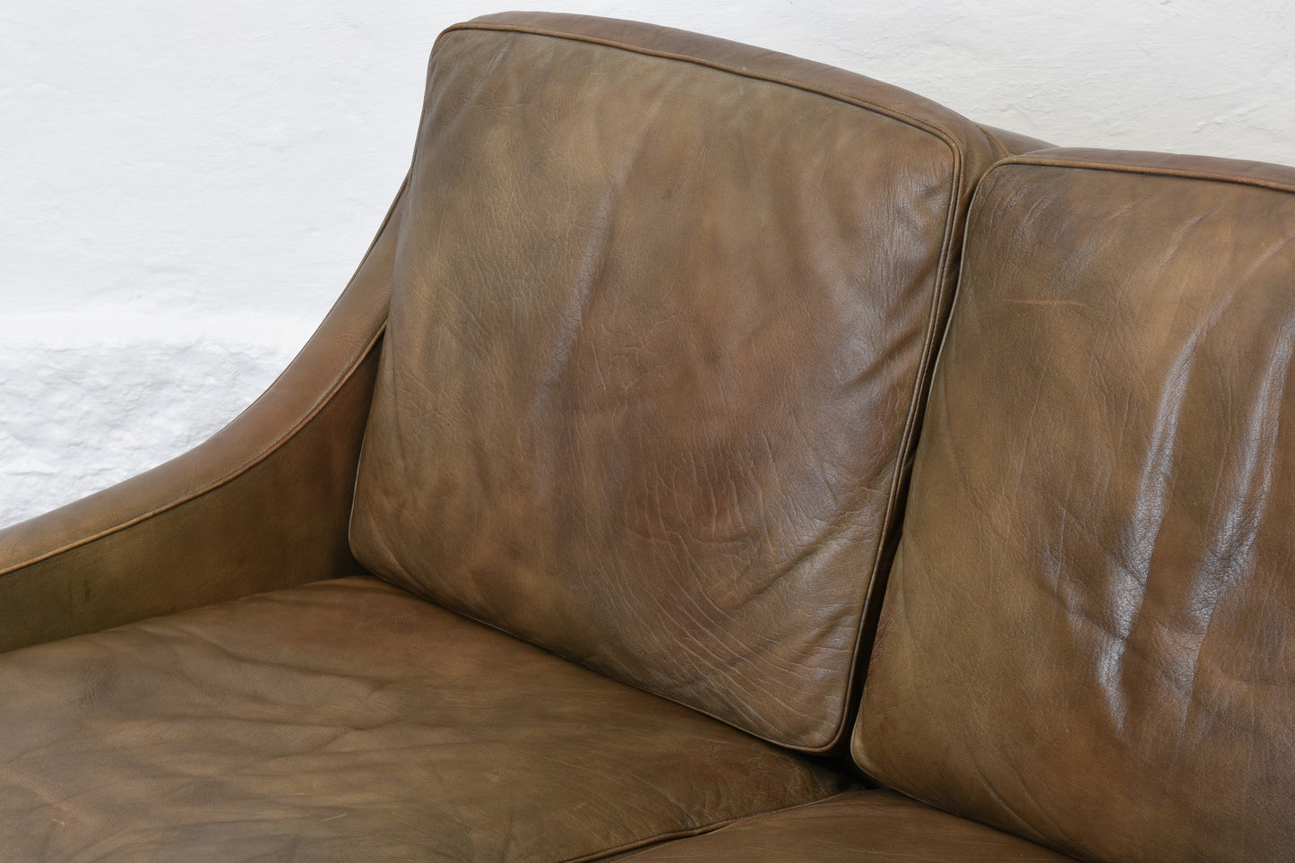 1960s two seat leather sofa on rosewood legs