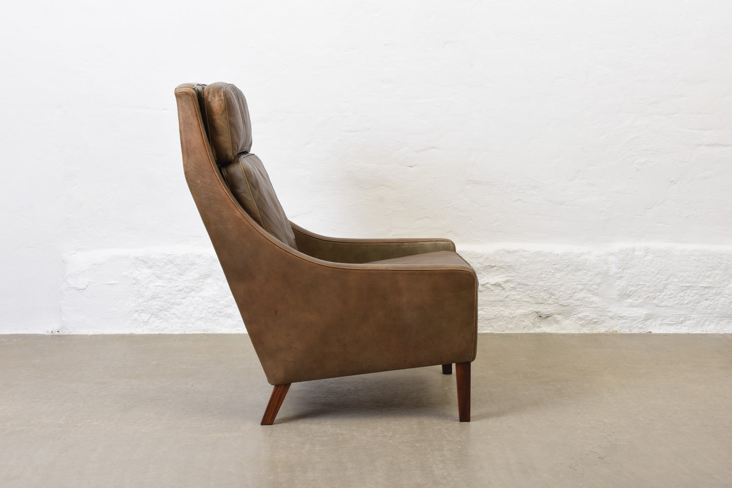 1960s high back leather lounger with footstool