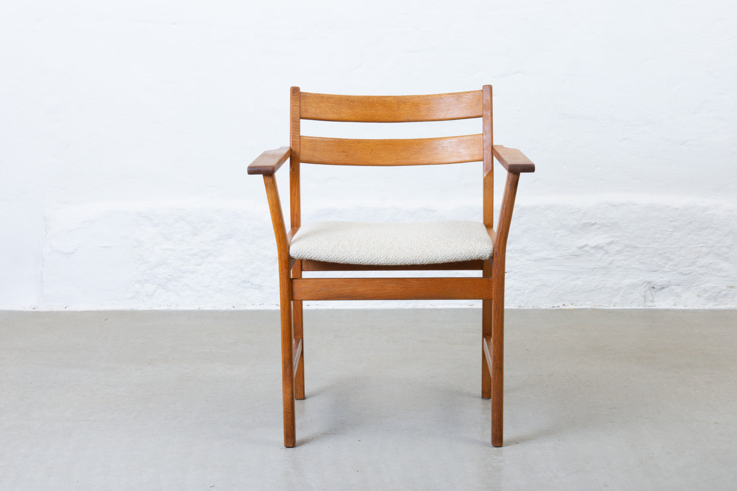 Newly reupholstered: 1960s oak armchair by Kurt Østervig