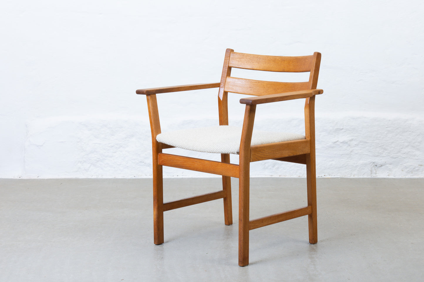Newly reupholstered: 1960s oak armchair by Kurt Østervig