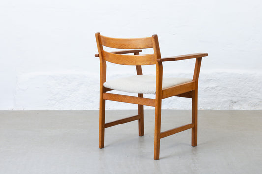 Newly reupholstered: 1960s oak armchair by Kurt Østervig