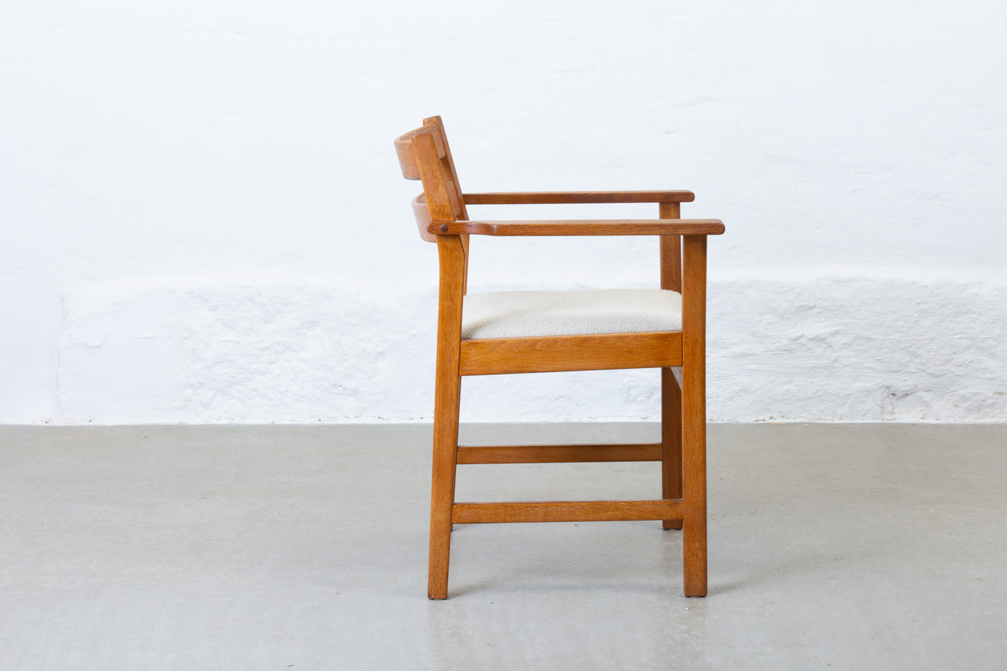 Newly reupholstered: 1960s oak armchair by Kurt Østervig