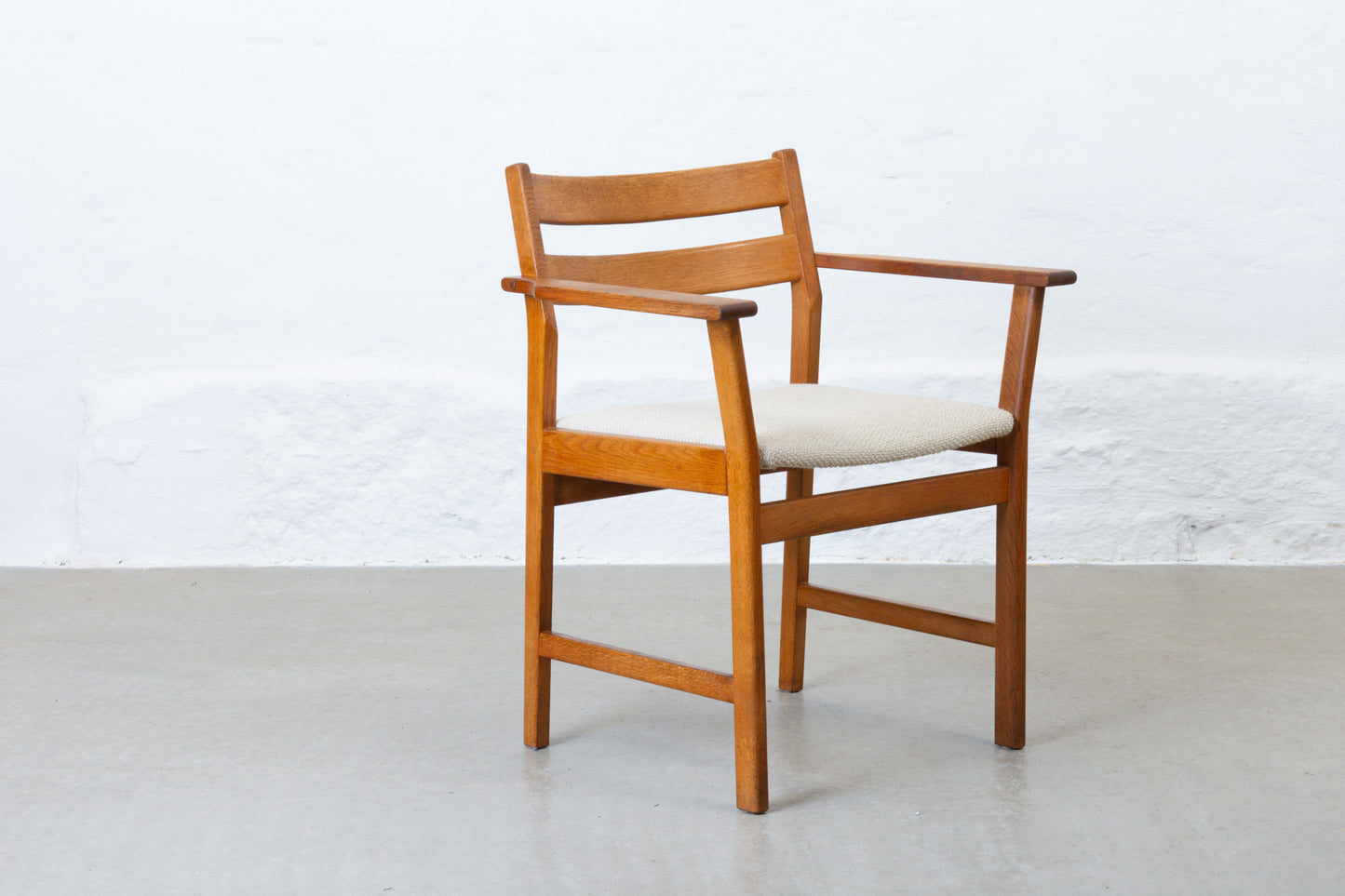 Newly reupholstered: 1960s oak armchair by Kurt Østervig
