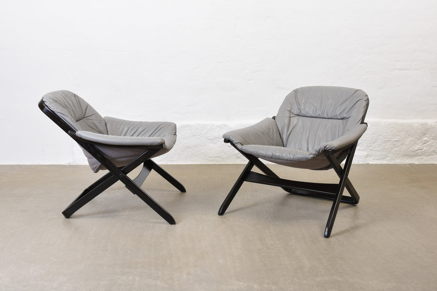Two available: 1970s Swedish pair of leather + beech lounge chairs