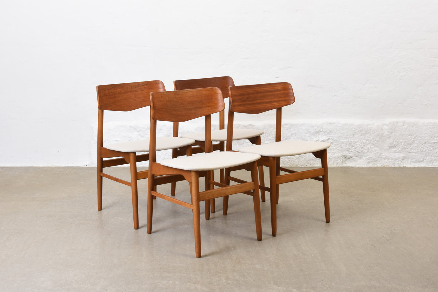 Newly reupholstered: 1960s set of four teak + beech dining chairs