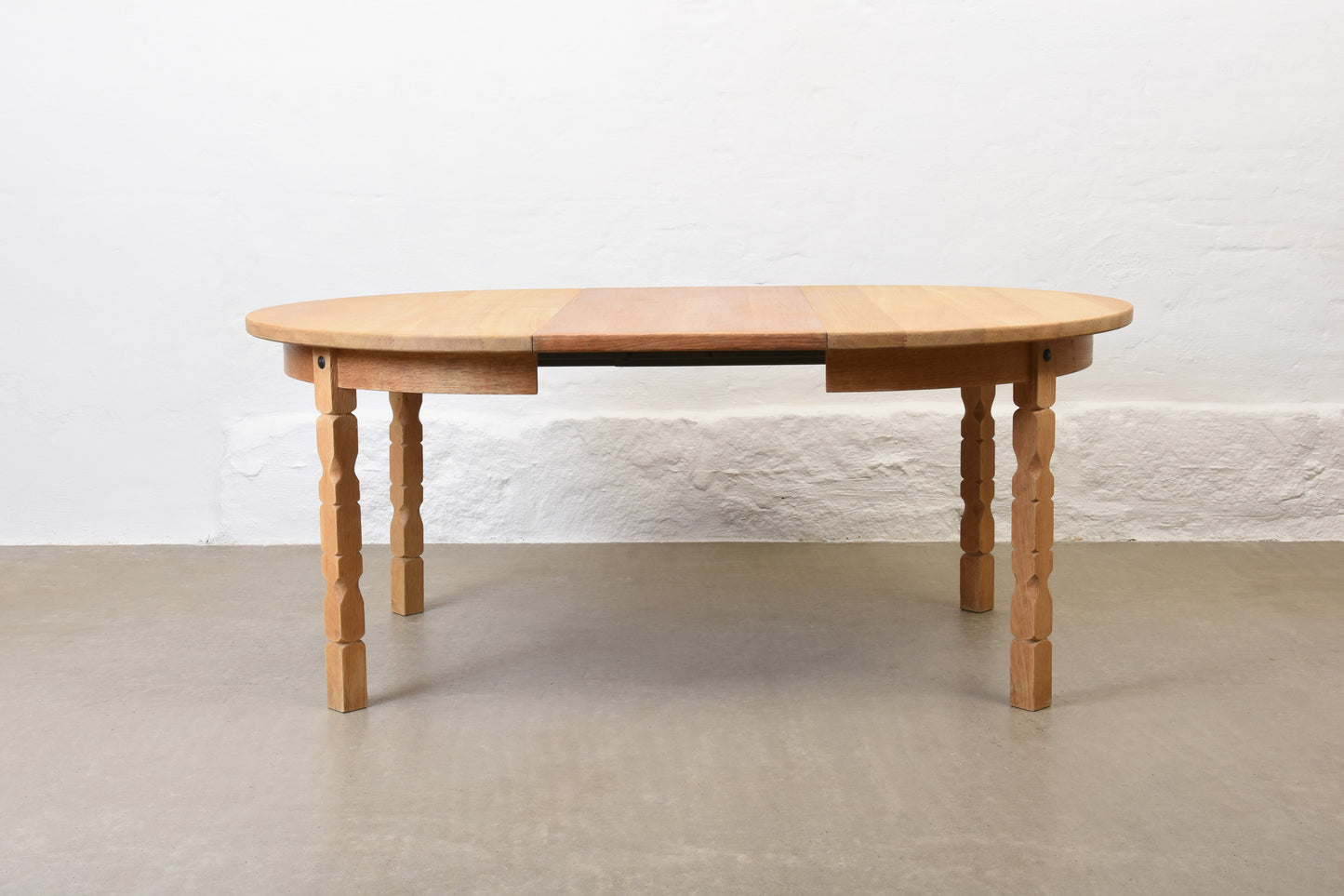 1970s extending oak dining table by Henning Kjærnulf