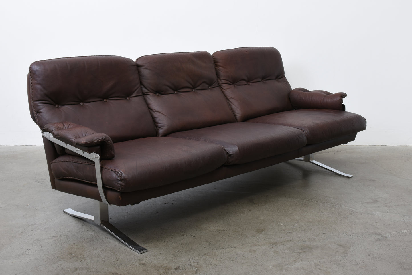 1960s leather + steel three seater by Arne Norell