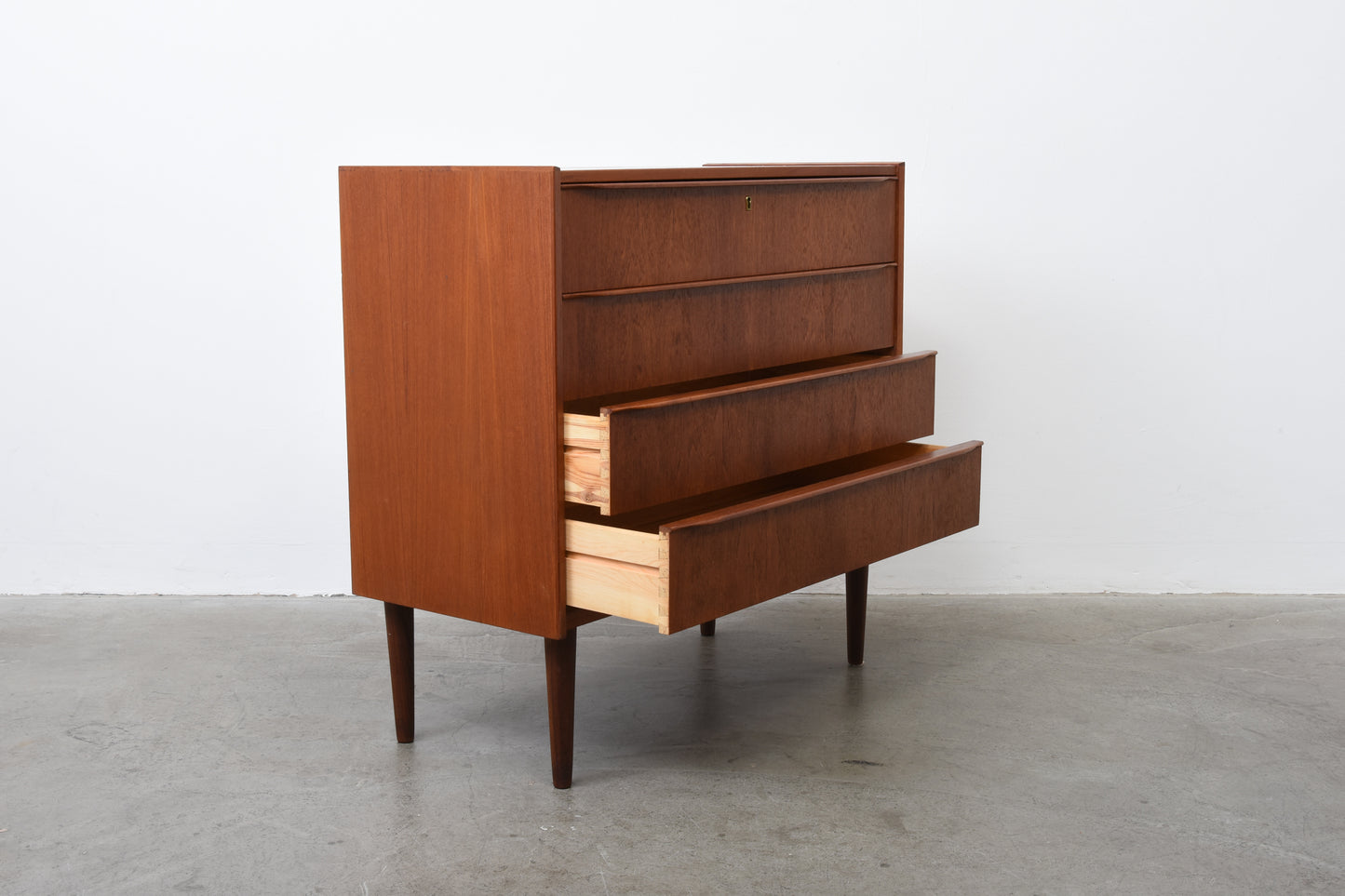 Low teak chest of drawers