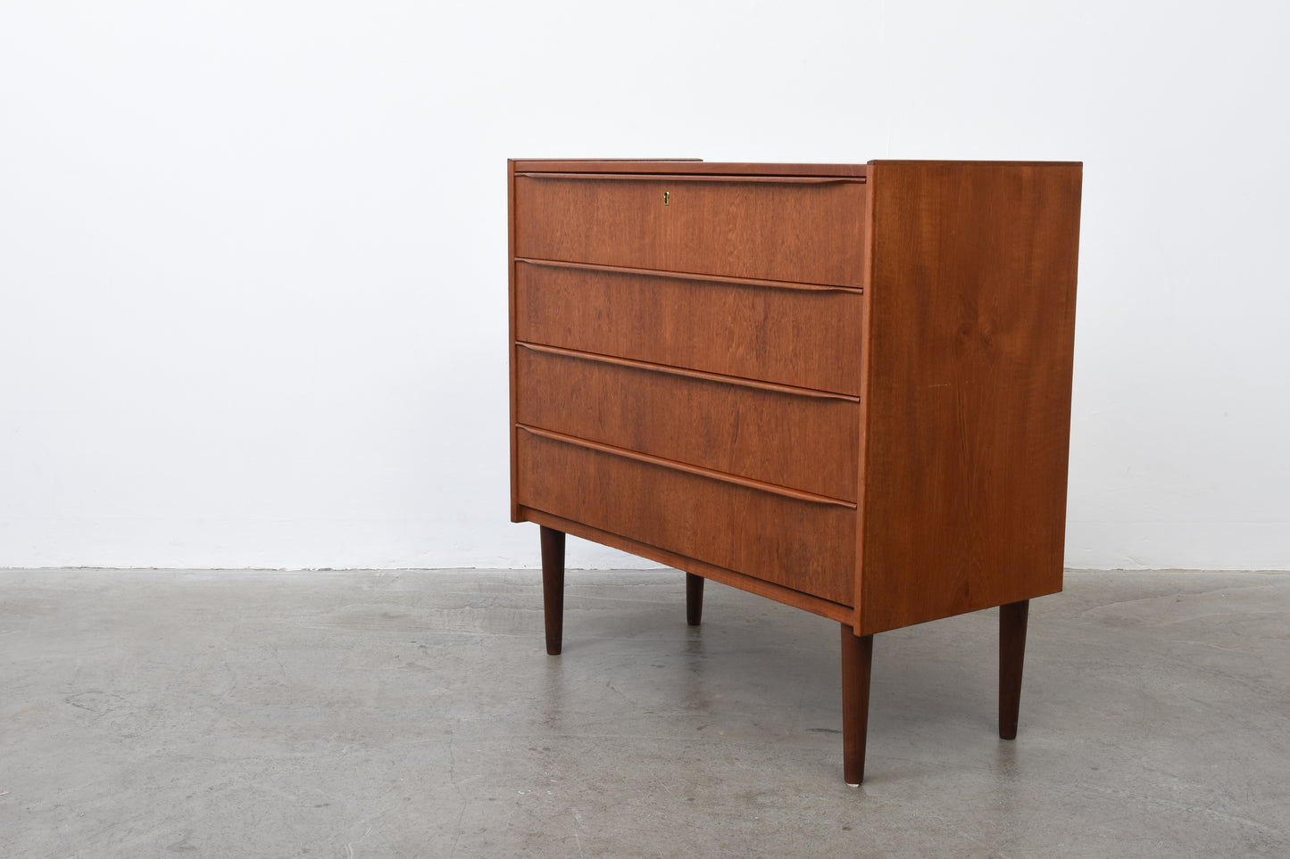 Low teak chest of drawers