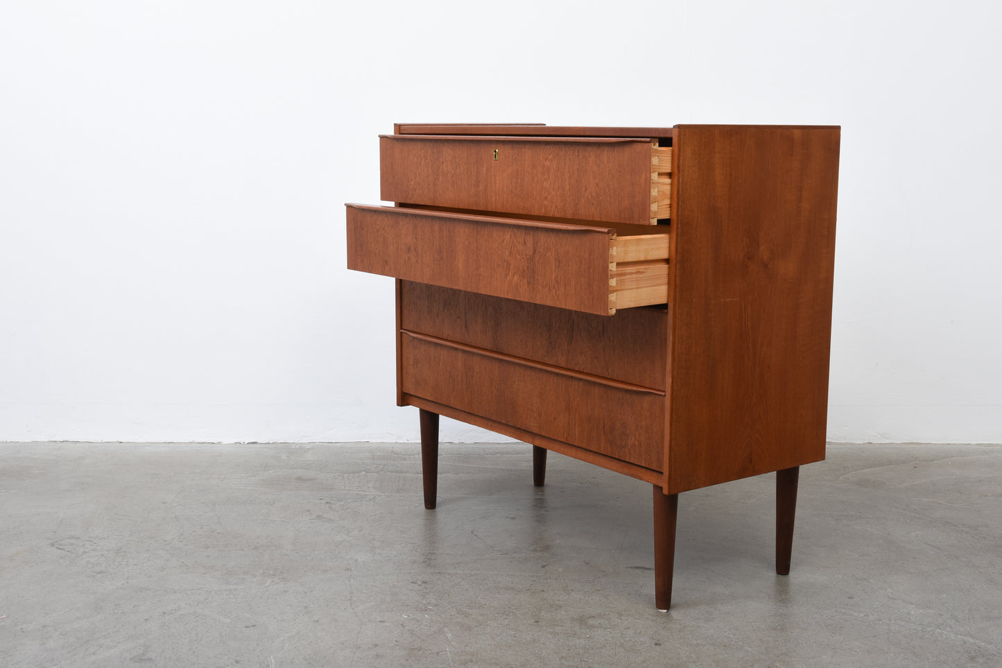 Low teak chest of drawers