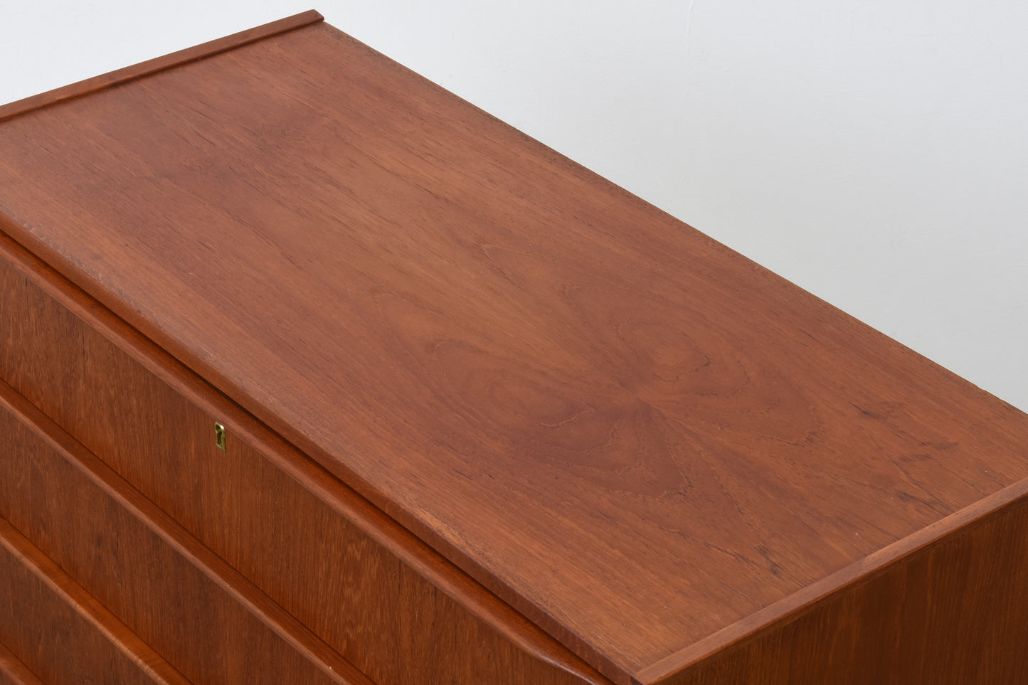 Low teak chest of drawers