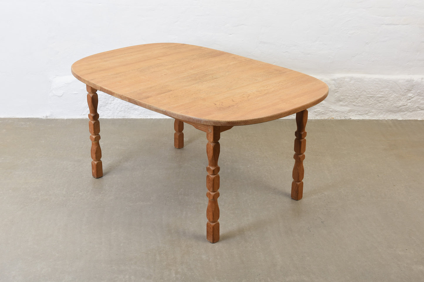 1970s extending oak dining table by Henning Kjærnulf