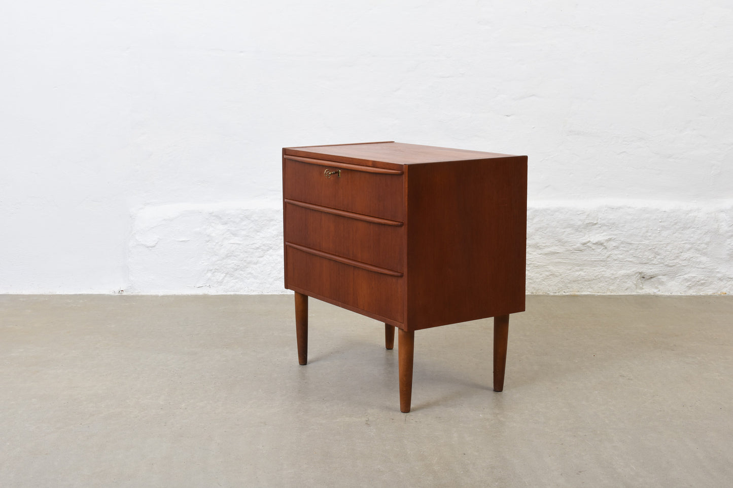 1960s low teak chest with lipped handles