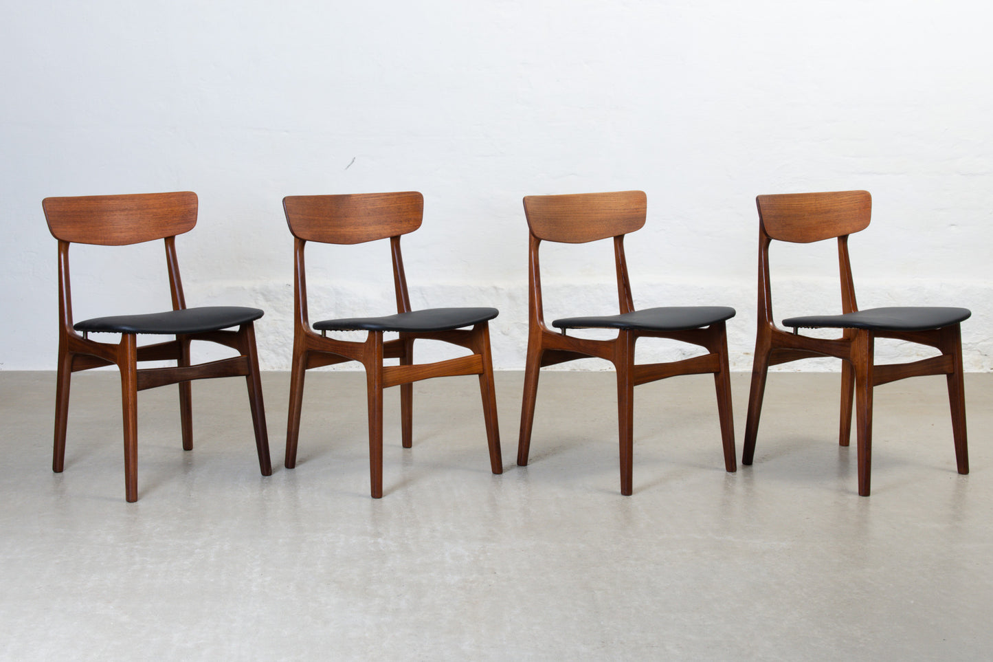 Newly reupholstered: 1960s set of four teak dining chairs