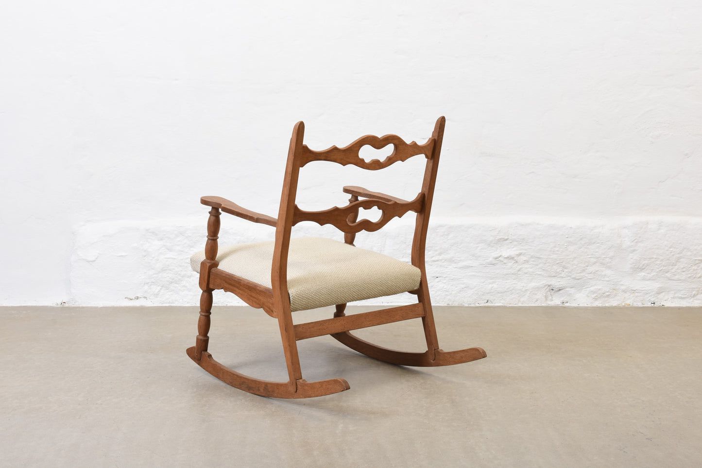 Newly reupholstered: 1960s oak rocking chair by Henning Kjærnulf