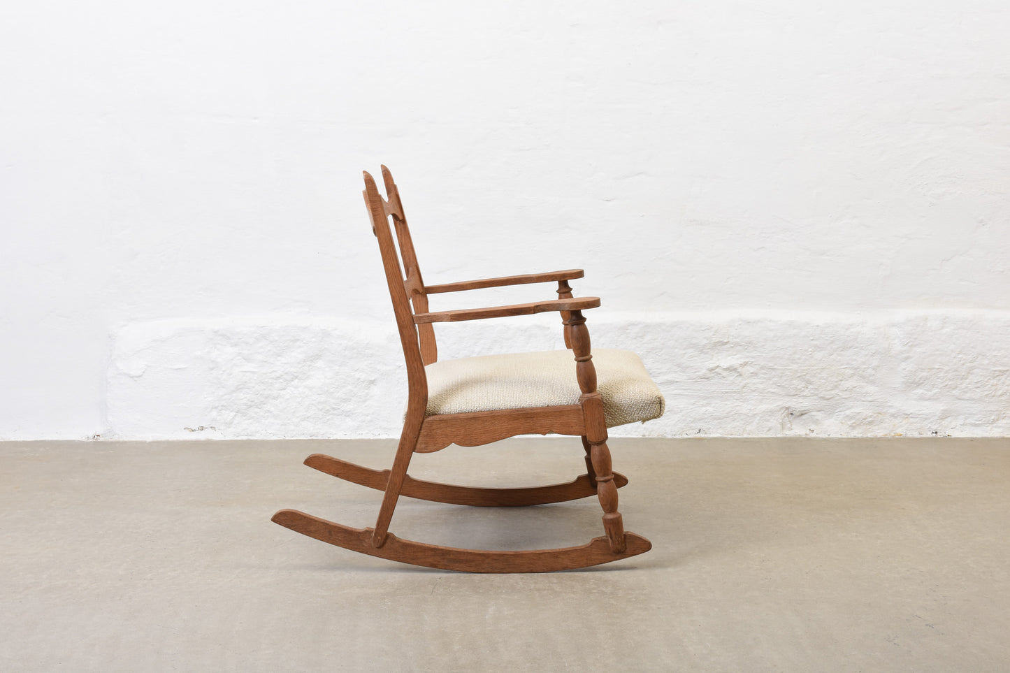 Newly reupholstered: 1960s oak rocking chair by Henning Kjærnulf