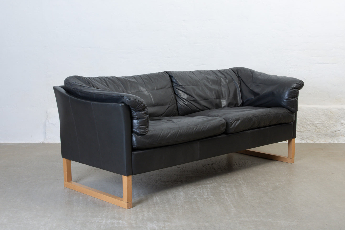 1980s leather sofa on beech sleigh legs