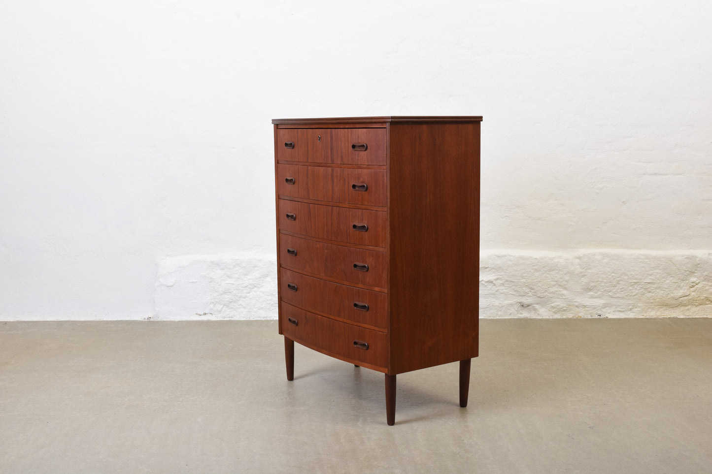 1950s bow-fronted chest of drawers in teak