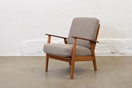 Newly reupholstered: 1950s teak + oak lounge chair