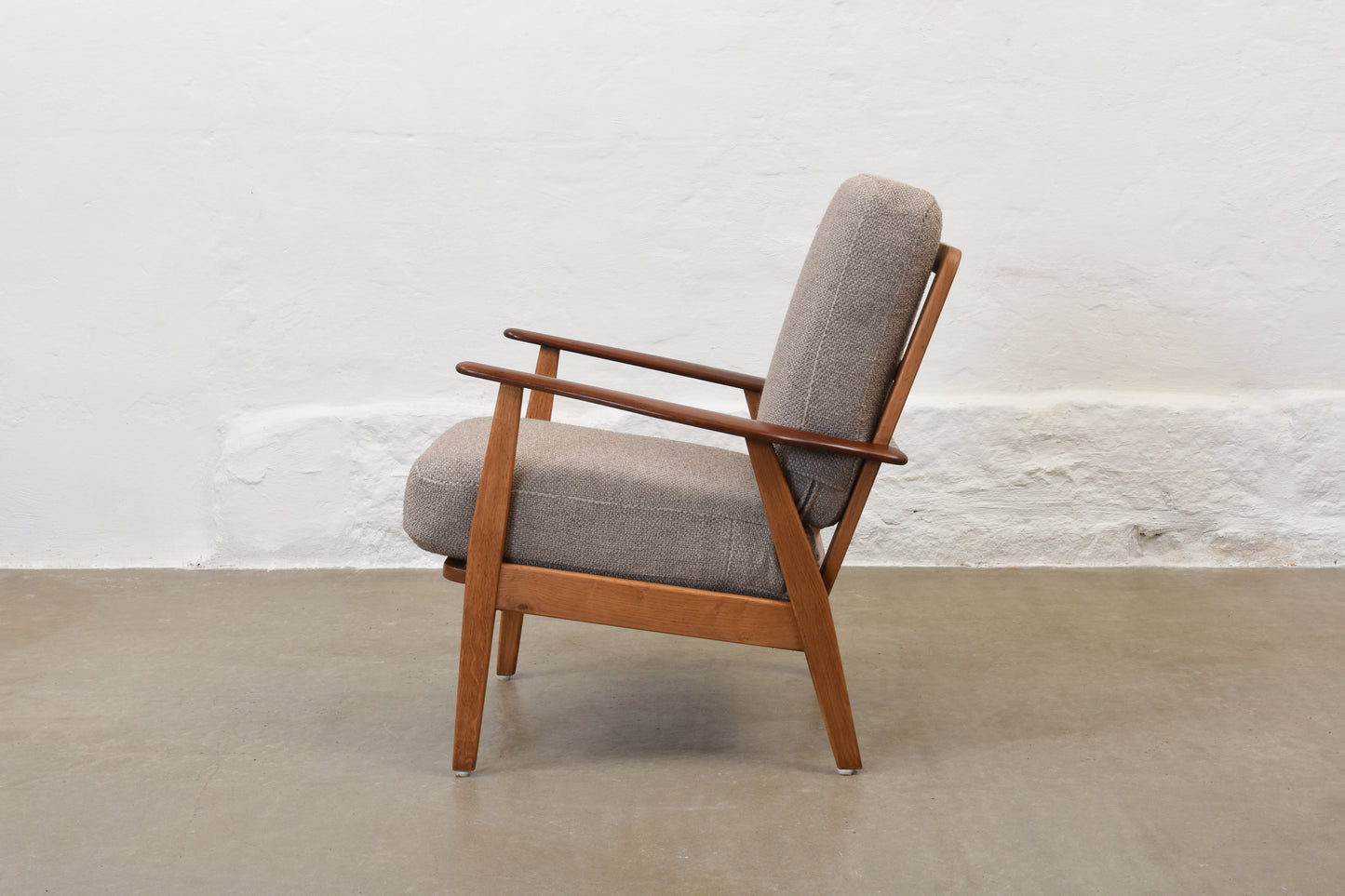 Newly reupholstered: 1950s teak + oak lounge chair