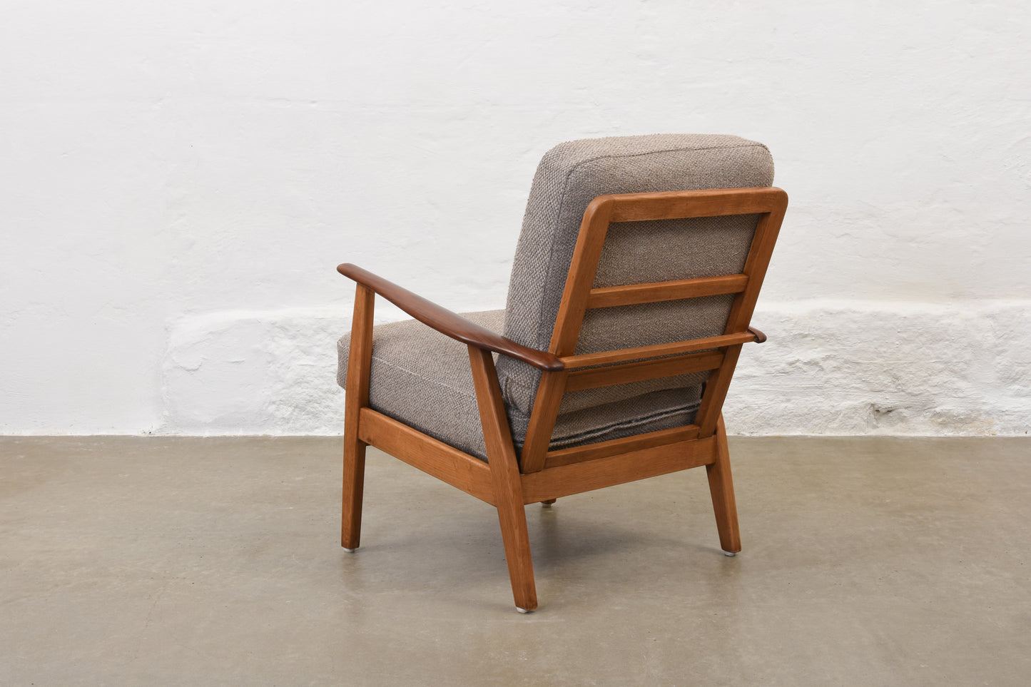 Newly reupholstered: 1950s teak + oak lounge chair