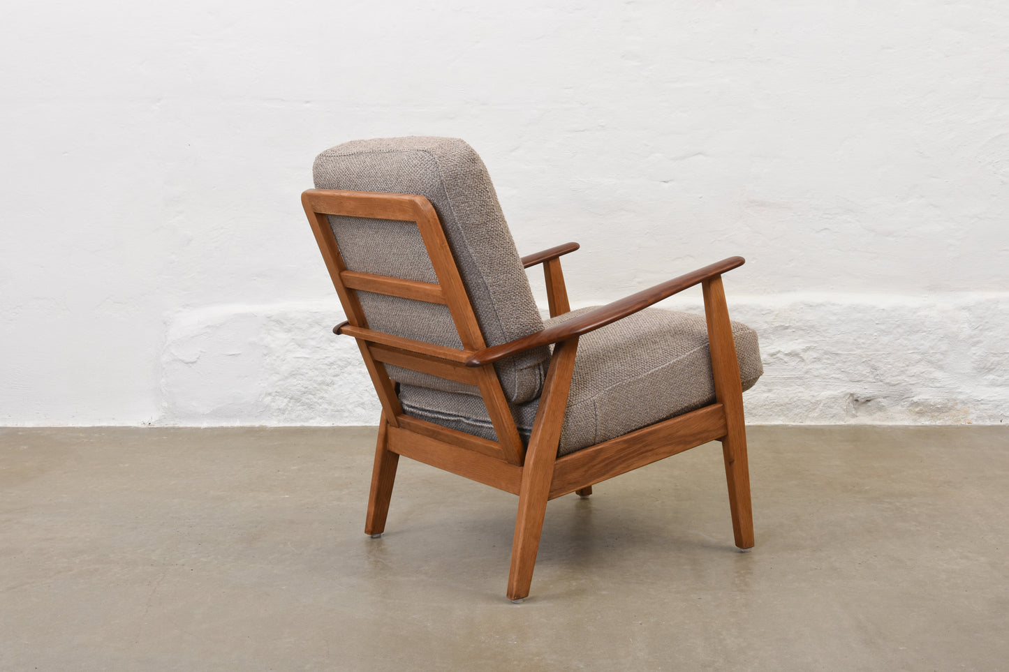 Newly reupholstered: 1950s teak + oak lounge chair