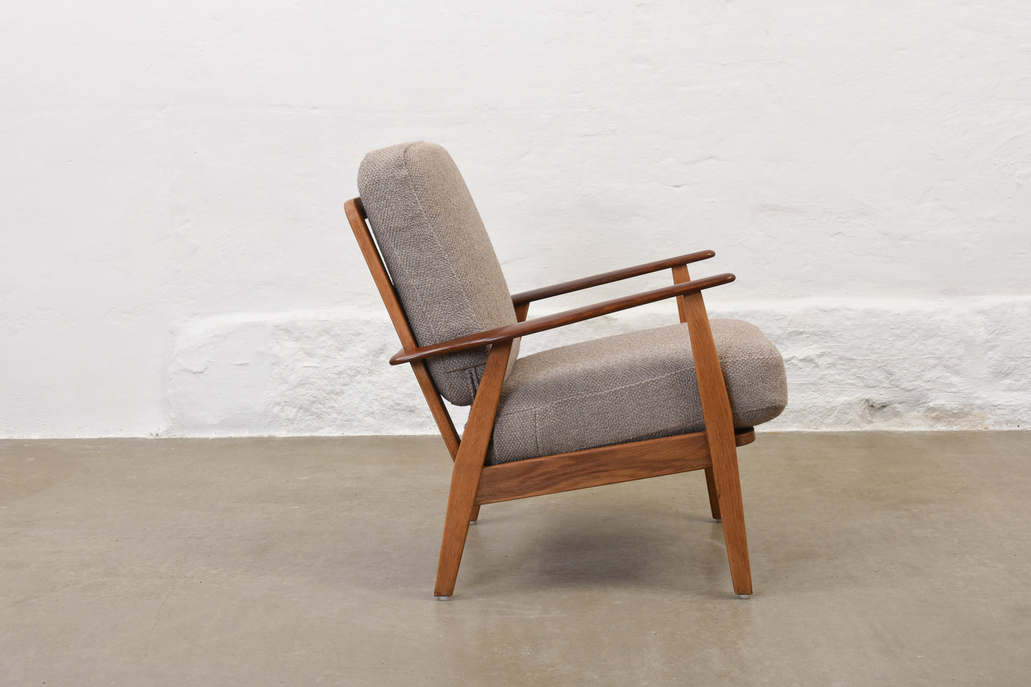 Newly reupholstered: 1950s teak + oak lounge chair