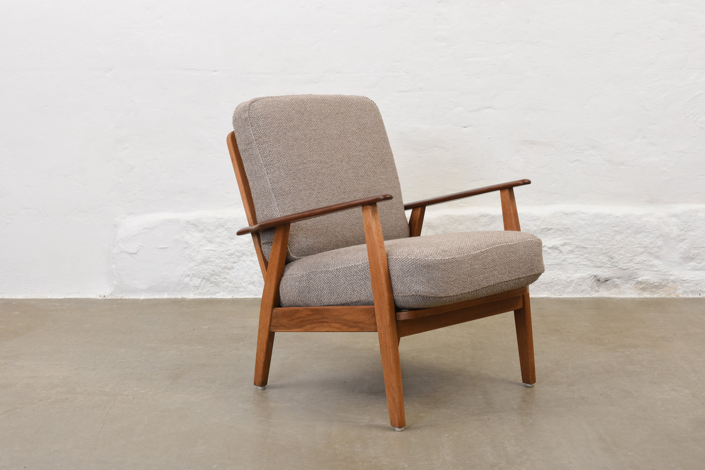 Newly reupholstered: 1950s teak + oak lounge chair