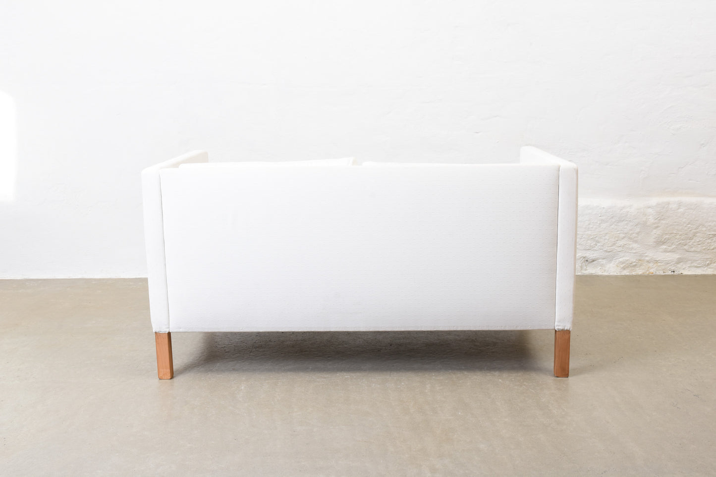 Vintage Danish two seat sofa in white cotton