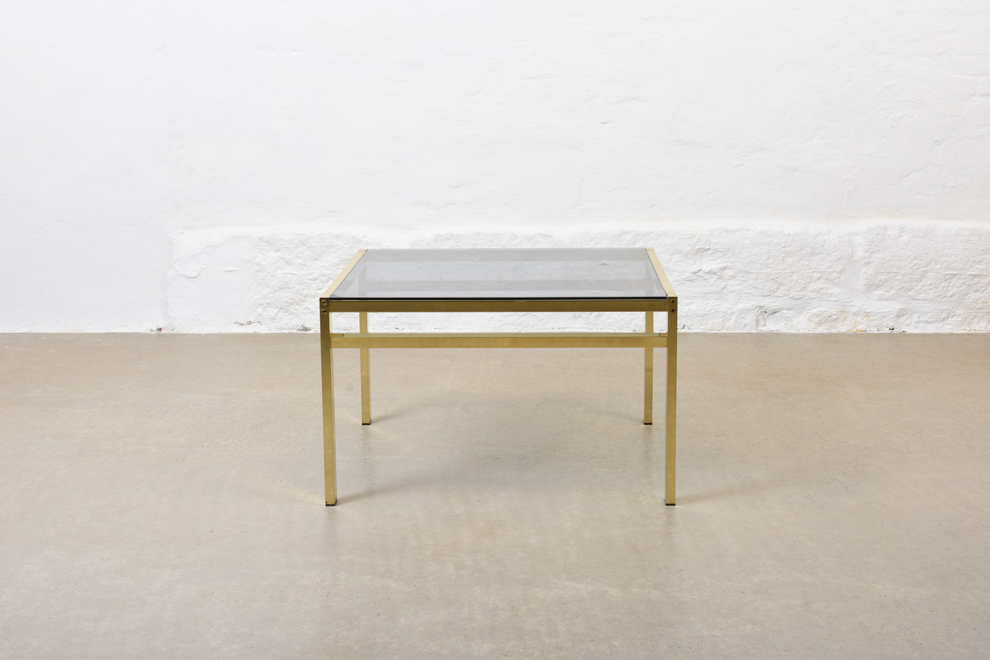 Two available: 1970s glass + brass coffee tables