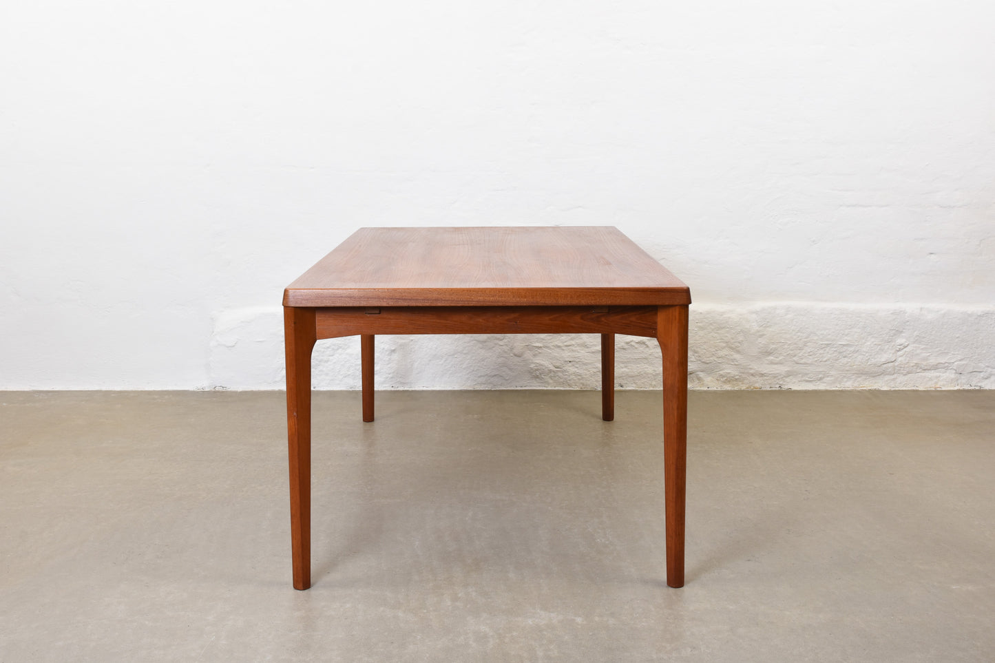 1960s extending dining table in teak by Henning Kjærnulf