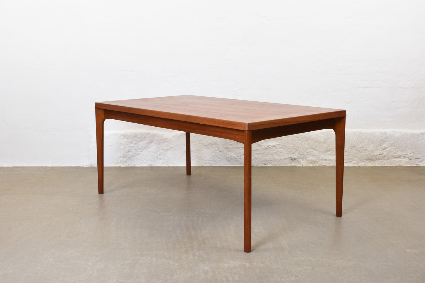 1960s extending dining table in teak by Henning Kjærnulf